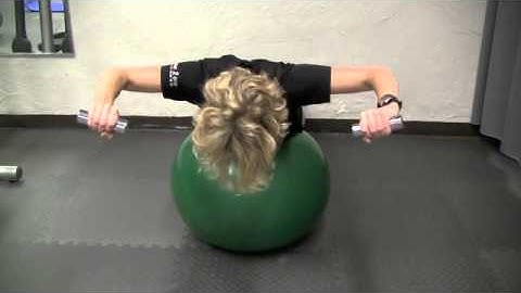Stability Ball Row, Rotate, Press Exercise by Laurie Nuyens
