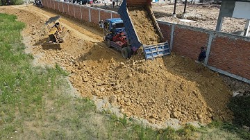 Best Excellent Machinery Building New Road , Bulldozer D20P Push Soil and 5 Ton truck Unloading