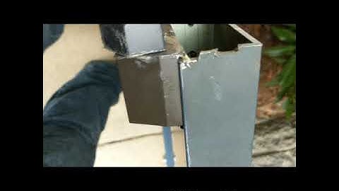 Installation of a full surface continuous hinge to repair a dragging commercial metal door.