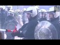 Water guns used on farmers outside eu parliament in brussels