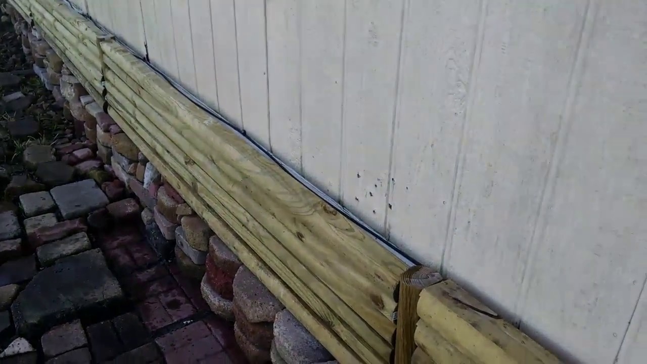 Landscape timbers for mobile home skirting. Log cabin siding.skirting