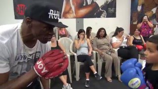 Floyd Mayweather Sr. working mitts with an amateur inside the Mayweather Boxing Club