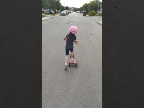 Abigail scootering along