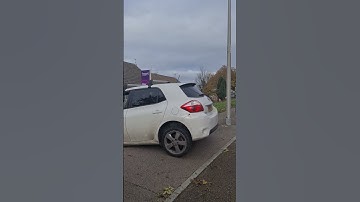 Amazon delivery driver struggles to get their car backed out