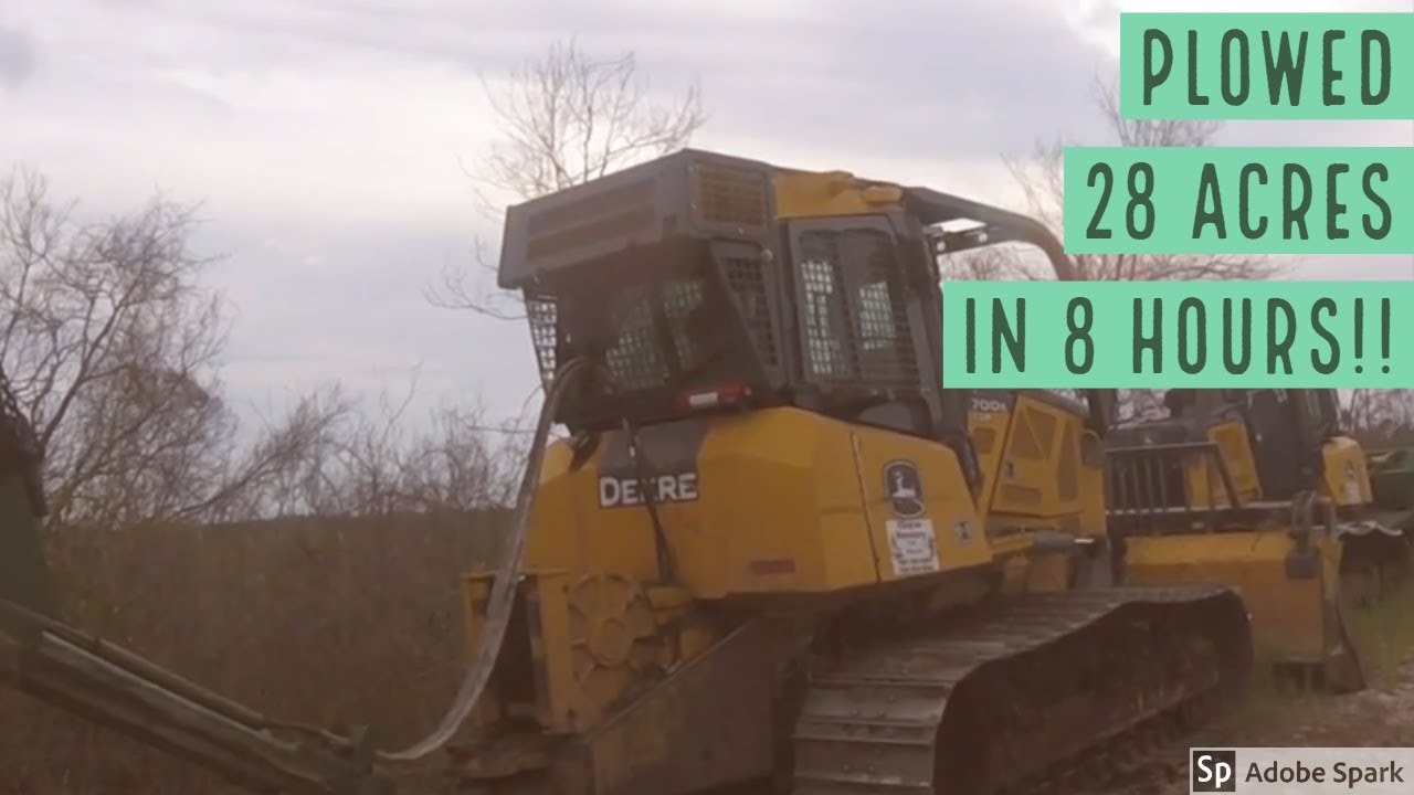 John Deere 700K Bulldozer & Savannah 140 plow near intercoastal