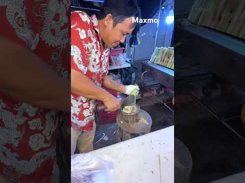 A vendor with a great idea adds value to sticky rice in bamboo and enhances its flavor. #streetfood