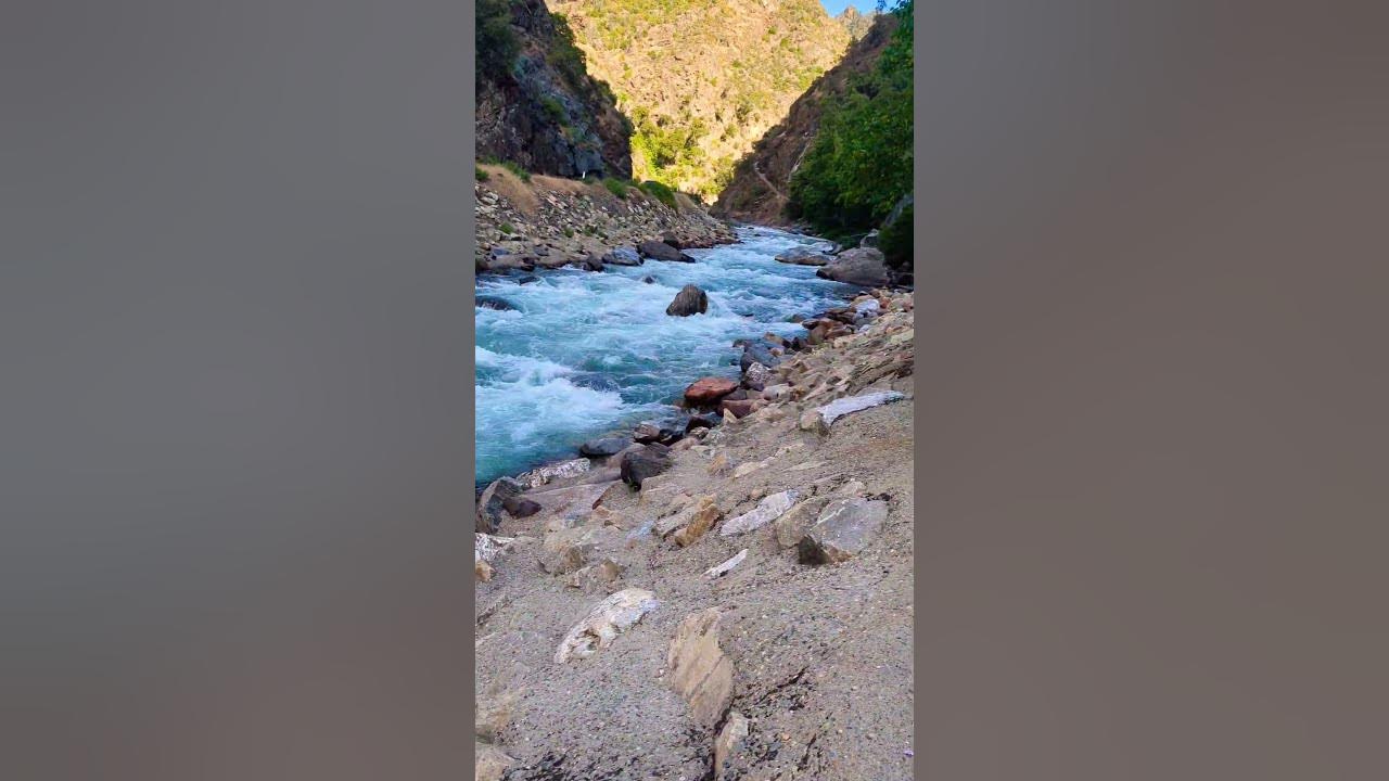 Beautiful water stream surrounded by mountains #waterstream #mountains