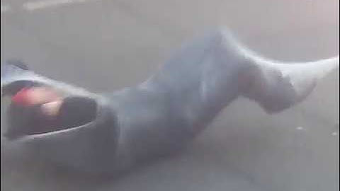 MAN JUMPS THROUGH CHRISTMAS TREE WRAPPING MACHINE"