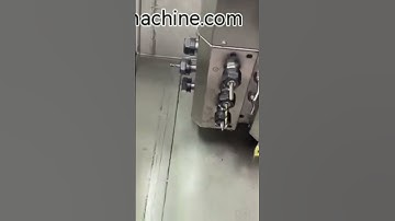 Tck6430 slant bed cnc lathe with live tool turret and automatic bar feeder.