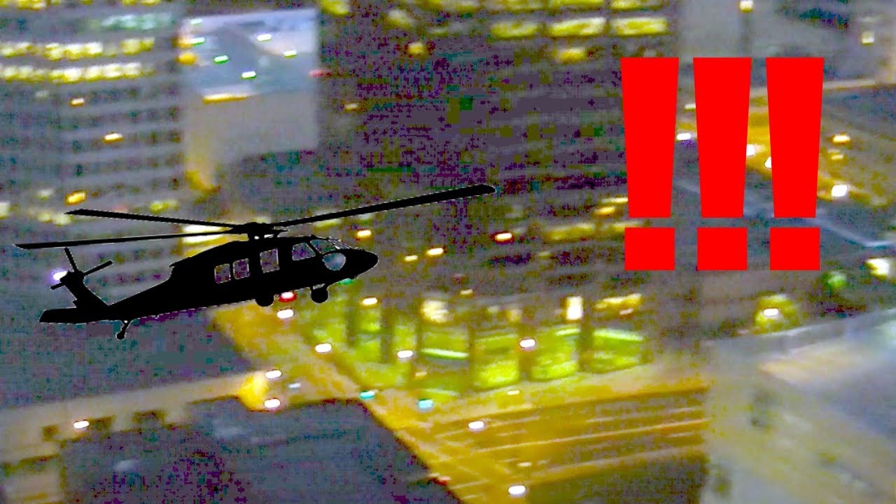 Looking down on Blackhawk Helicopters flying down the streets of Saint