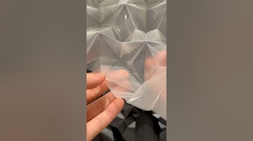 Folding a translucent sheet into geometric forms. Origami; Thaumazein(Translucent)