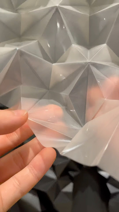 Folding a translucent sheet into geometric forms. Origami; Thaumazein(Translucent)