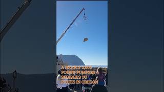 PUMPKIN DROP: Nearly one-ton behemoth smashes into pool