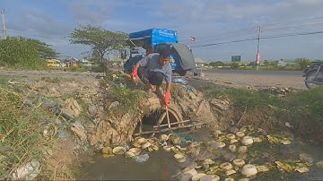 Cleaning plastic and trash blockage water flooded in Culvert pipe