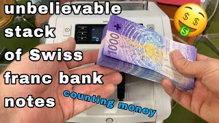 unbelievable stack of swiss 1000 CHF  franc bank notes counting by money machine