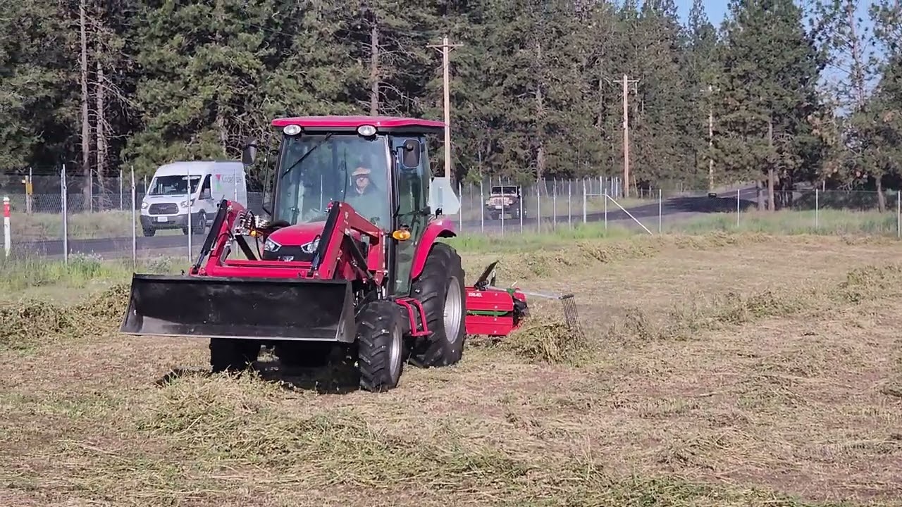 Tym 574 with belt rake