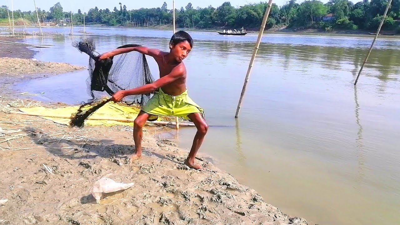 Best cast net fishing in village river - Professional little boy fishing by net - SP fishing world