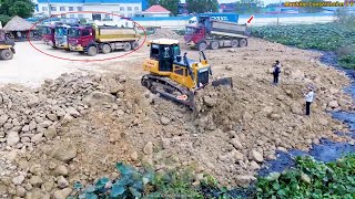 Nice Fantastic activity Bulldozer SHANTUI Moving Soil Stone into Water and Dump truck Unloading Soil