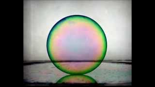 Partial coalescence of soap bubbles