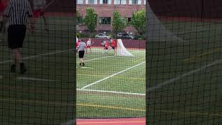 Shot on goal in a lacrosse game. Chaminade Vs Manhassett JV A game.