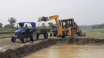 JCB 3DX Working In River Side / JCB Dozer Loading A Mix Ballast In Tractor Video