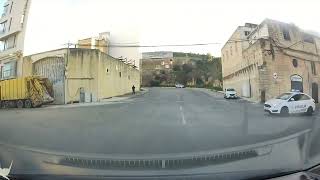 Driver Nearly Crashes Into Police Car at Intersection