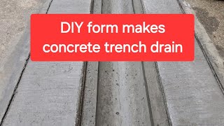 Channel drain in concrete from homemade form, covered with steel bar grating