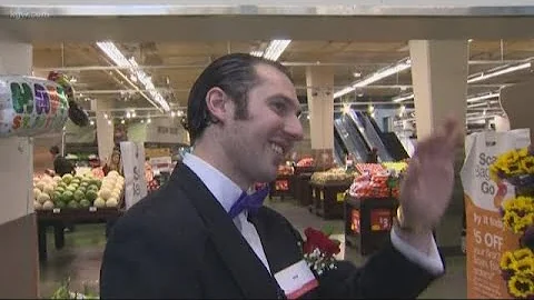 Fred Meyer greeter Sam Sherer serves the Southeast...