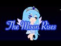 The moon rises