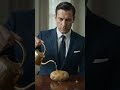 A man in a suit carefully watering a single potato. #shorts #shortsfeed