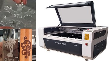 STJ1390 CO2 laser engraving and cutting machine cutting acrylic, glass cups with rotating shaft.