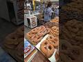 Bakery Work. Preparing Big German Pretzels. Italy Food Festival