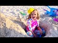 Katy and Max Stories on the beach with daddy