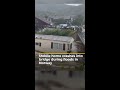 Mobile home crashes into bridge during floods in Norway | AJ #shorts