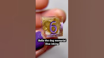 Purple numbers top off this dog memorial dice set