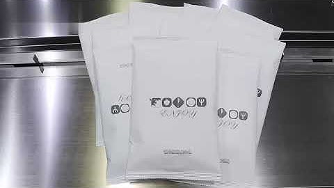 Disposable tableware horizontal flow wrapper machine