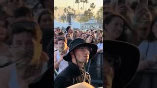 Sabrina Carpenter waving to Barry Keoghan during her Coachella performance.