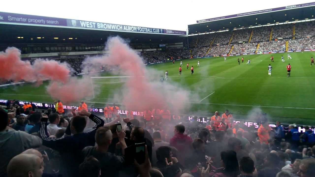 Man United fan sets flare off at west brom away