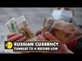 Russian currency tumbles to a record low as markets react to new economic sanctions | English News