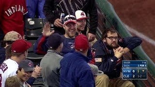 Indians fan flashes the leather on foul ball