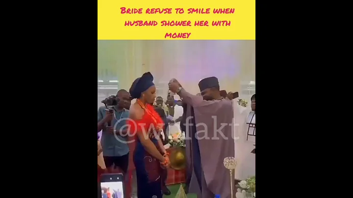 Bride refuse to smile when husband shower her with money