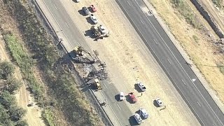 Large sinkhole shuts down California freeway