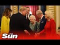 Donald Trump is welcomed by Prince Charles at Buckingham Palace ahead of meeting with world leaders