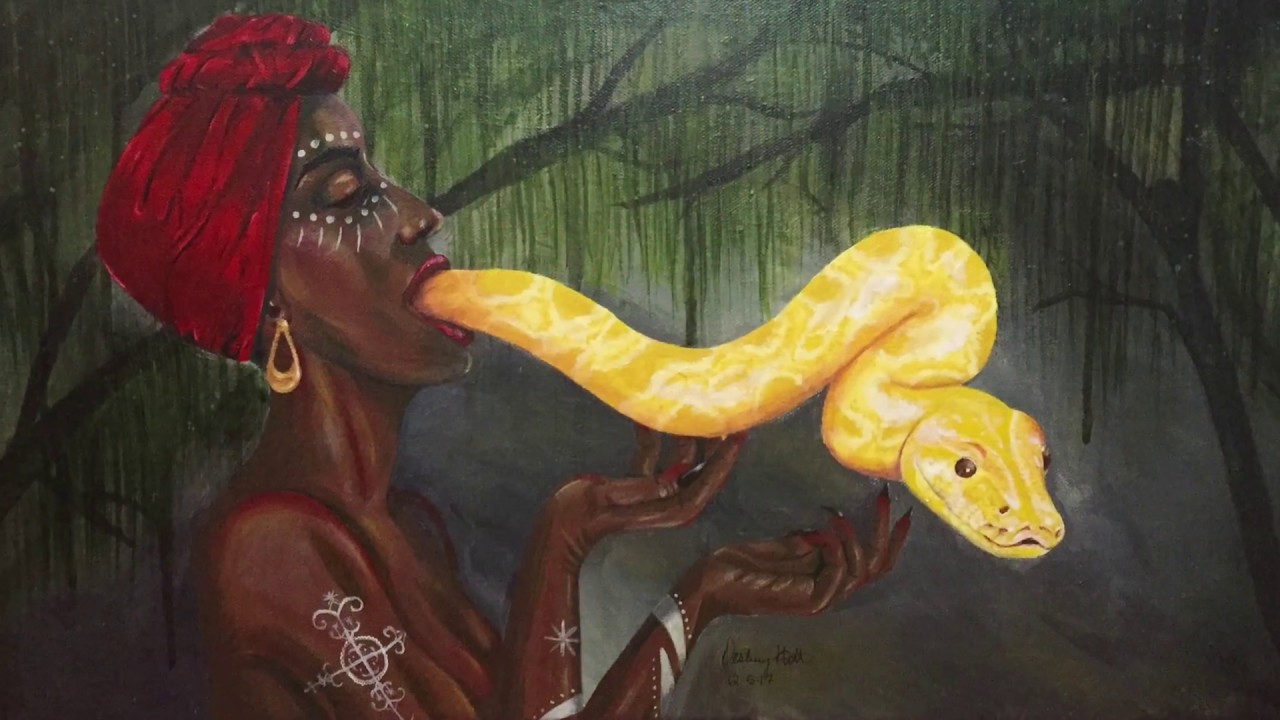 It shows a woman giving service to the Simbi god(s). The snake in voodoo is...