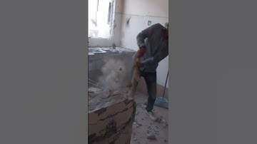 A worker is using a hammer to demolish a building #building #construction #asmrvideo