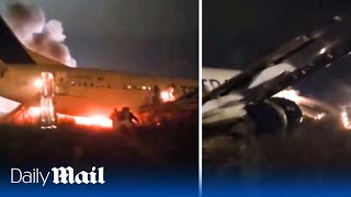 Boeing 737 plane catches fire after it skids off runway in Senegal during terrifying moment