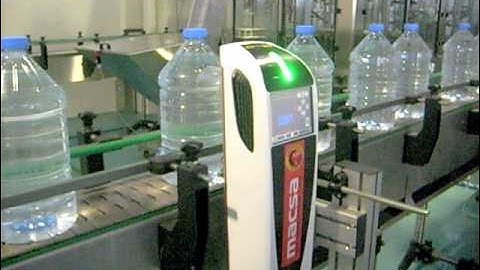 iCON CO2 laser by MACSA coding 3 lines of text in a water PET carafe