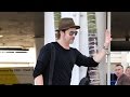 Brad Pitt Plays It Up For The Paps At LAX
