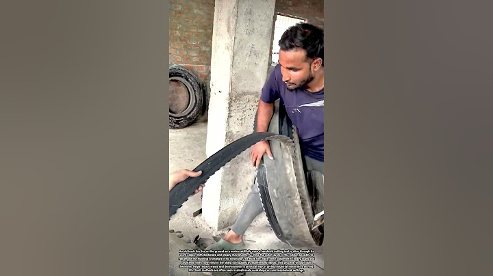 Cutting the Edges of an Old Truck Tire to Repurpose Heavy Industrial Rubber