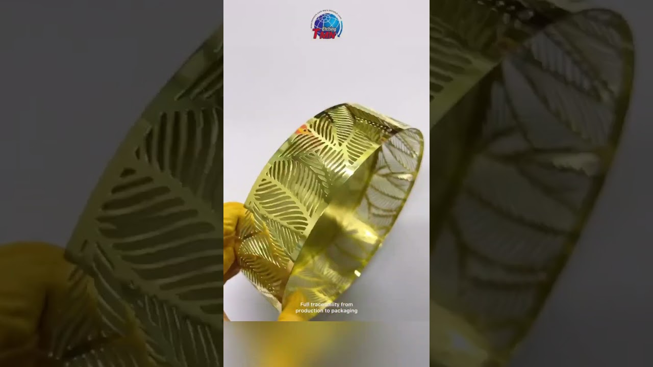 Gold candle holder with leaves patterns as Christmas ornaments 